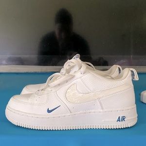 White Air Force 1s with small blue check holographic nike check
